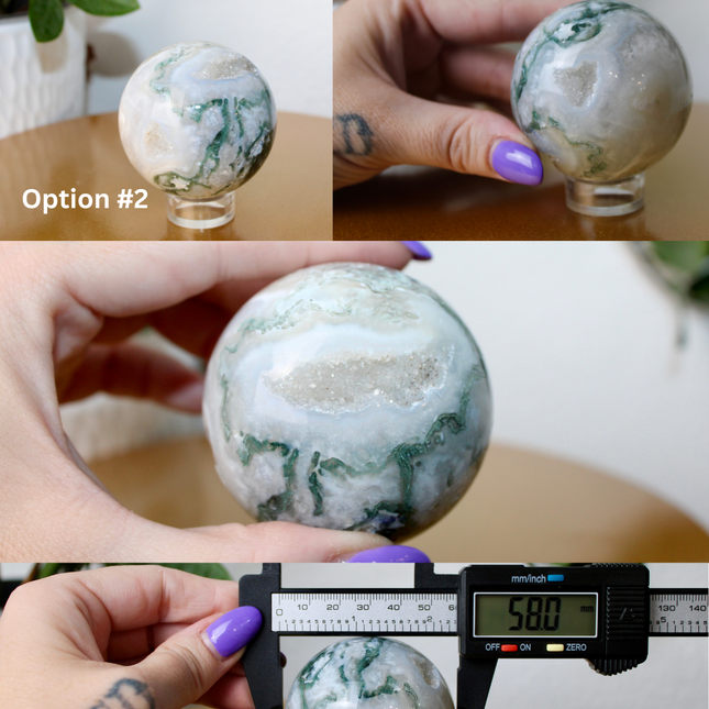 This XL Moss Agate Sphere features a stunning mix of natural green inclusions and cloudy white tones, reminiscent of forest landscapes or underwater gardens. Each sphere is one of a kind, with swirling patterns and depth that make it a true conversation piece.