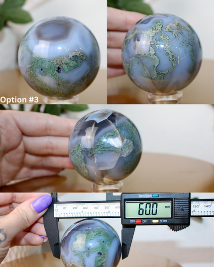 This XL Moss Agate Sphere features a stunning mix of natural green inclusions and cloudy white tones, reminiscent of forest landscapes or underwater gardens. Each sphere is one of a kind, with swirling patterns and depth that make it a true conversation piece.
