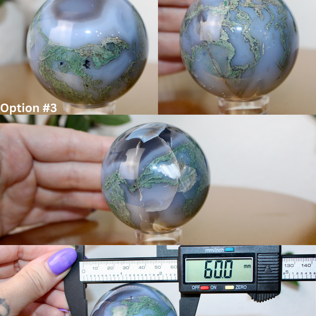 This XL Moss Agate Sphere features a stunning mix of natural green inclusions and cloudy white tones, reminiscent of forest landscapes or underwater gardens. Each sphere is one of a kind, with swirling patterns and depth that make it a true conversation piece.