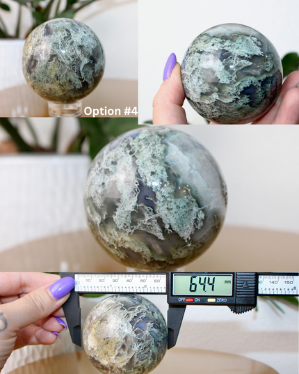 This XL Moss Agate Sphere features a stunning mix of natural green inclusions and cloudy white tones, reminiscent of forest landscapes or underwater gardens. Each sphere is one of a kind, with swirling patterns and depth that make it a true conversation piece.