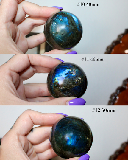 Three views of a labradorite crystal ball held by a hand with purple nail polish.