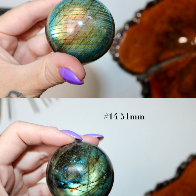 Two images showing a hand holding a labradorite crystal ball with measurements below.
