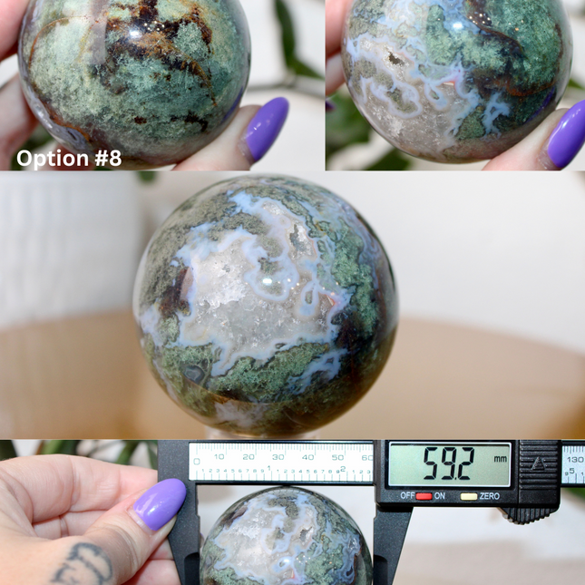 This XL Moss Agate Sphere features a stunning mix of natural green inclusions and cloudy white tones, reminiscent of forest landscapes or underwater gardens. Each sphere is one of a kind, with swirling patterns and depth that make it a true conversation piece.