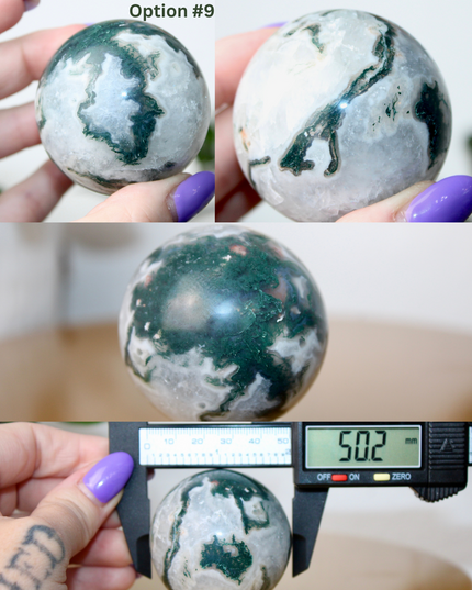 This XL Moss Agate Sphere features a stunning mix of natural green inclusions and cloudy white tones, reminiscent of forest landscapes or underwater gardens. Each sphere is one of a kind, with swirling patterns and depth that make it a true conversation piece.