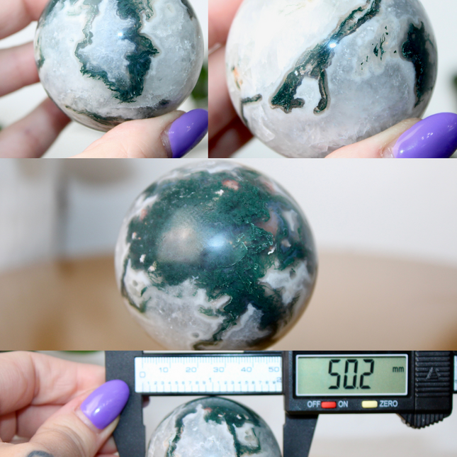 This XL Moss Agate Sphere features a stunning mix of natural green inclusions and cloudy white tones, reminiscent of forest landscapes or underwater gardens. Each sphere is one of a kind, with swirling patterns and depth that make it a true conversation piece.