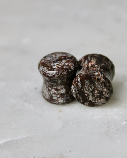 These Double Flare Brown Snowflake Obsidian Plugs bring together natural stone beauty and meaningful energy—perfect for everyday wear, spiritual practice, or anyone seeking balance with a striking, earthy edge.