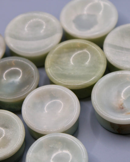 A beautiful pair of Natural Calcite stone plugs, hand-carved and polished into a smooth double flare shape for a secure and comfortable fit. These ear gauges showcase the soft, luminous quality of calcite, with creamy whites, warm honey tones, and subtle translucency that varies from piece to piece. Each plug highlights unique natural banding and organic patterns, making every pair one-of-a-kind.