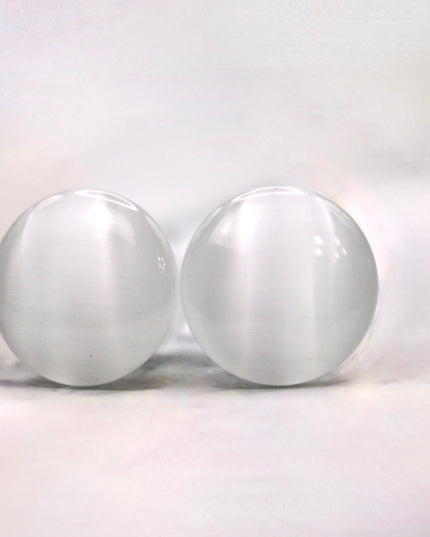 Polished white cat eye glass plugs with subtle chatoyancy and secure single flare design – perfect for everyday wear.