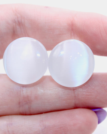 Polished white cat eye glass plugs with subtle chatoyancy and secure single flare design – perfect for everyday wear.