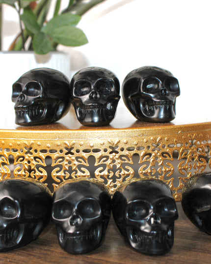 This Black Obsidian Skull Carving blends bold visual impact with detailed craftsmanship. Perfect for display in any setting, each polished obsidian skull showcases the rich depth and shine of natural volcanic glass.