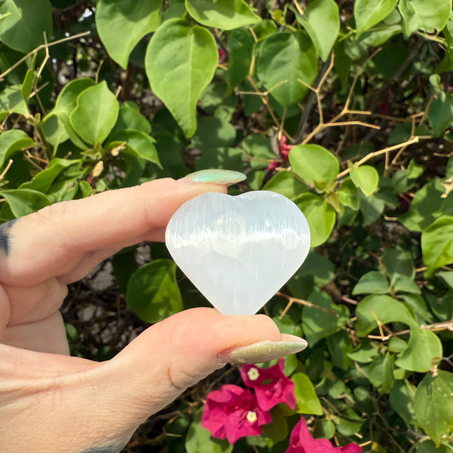 Bring calm, clarity, and loving energy into your life with this beautifully polished 30mm Selenite Heart. Carved from genuine selenite, this heart-shaped crystal is perfect for energy cleansing, emotional healing, and amplifying peaceful vibes in any space.