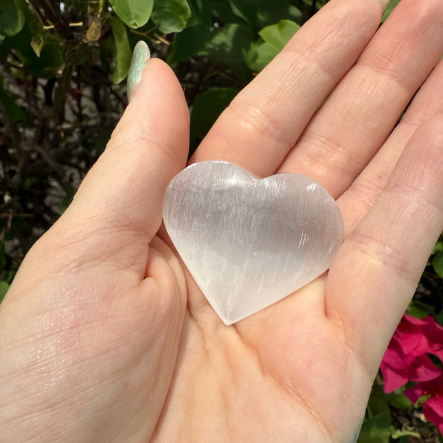 Bring calm, clarity, and loving energy into your life with this beautifully polished 30mm Selenite Heart. Carved from genuine selenite, this heart-shaped crystal is perfect for energy cleansing, emotional healing, and amplifying peaceful vibes in any space.