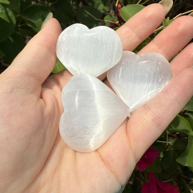 Bring calm, clarity, and loving energy into your life with this beautifully polished 30mm Selenite Heart. Carved from genuine selenite, this heart-shaped crystal is perfect for energy cleansing, emotional healing, and amplifying peaceful vibes in any space.
