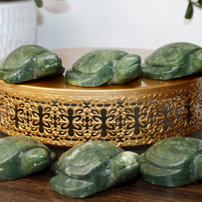 This Xiuyan Jade Turtle Carving is a beautifully detailed figurine made from genuine jade stone. Hand-carved and polished, it features gentle green tones and natural variations that make each piece one of a kind. Whether used as a decorative accent or gifted to a collector, this turtle brings a timeless and earthy charm to any space.