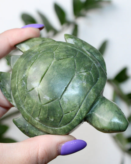 This Xiuyan Jade Turtle Carving is a beautifully detailed figurine made from genuine jade stone. Hand-carved and polished, it features gentle green tones and natural variations that make each piece one of a kind. Whether used as a decorative accent or gifted to a collector, this turtle brings a timeless and earthy charm to any space.