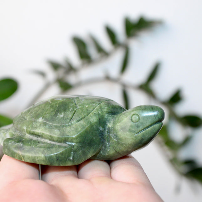 This Xiuyan Jade Turtle Carving is a beautifully detailed figurine made from genuine jade stone. Hand-carved and polished, it features gentle green tones and natural variations that make each piece one of a kind. Whether used as a decorative accent or gifted to a collector, this turtle brings a timeless and earthy charm to any space.