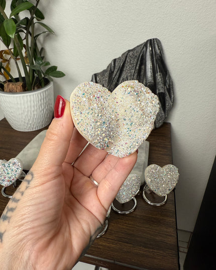 These Electroplated Aura Quartz Hearts combine the universal symbol of love with brilliant color and energy—set beautifully on a metal stand for easy display. Whether you're building your altar, brightening a room, or gifting crystal magic, pick the piece that sparks your spirit.