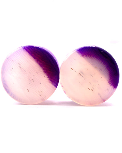 These Purple Striped Agate Plugs showcase eye-catching banded patterns and vivid color in a comfortable double flare design. Polished to a glossy finish, they’re a stylish choice for stretched ear jewelry collections.
