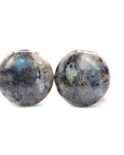 These single flare plugs are crafted from genuine Larvikite, often called Black Labradorite, and feature a dark, elegant appearance with natural silver or blue reflective flash. Each plug is polished to a smooth finish for comfort and style.