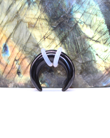 This Obsidian Septum Pincher is carved from genuine volcanic glass and polished to a smooth, glossy finish.