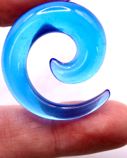 These Blue Acrylic Spiral Tapers offer a bold, colorful twist to your stretched ear collection. With their vibrant blue tone and swirling design, they’re perfect for adding movement and personality to your look. Made from lightweight acrylic, they’re easy to wear and ideal for daily use or special occasions.