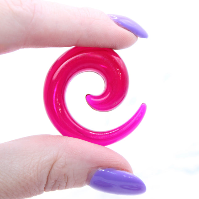 These Purple Acrylic Spiral Taper Earrings are a stylish and low-maintenance option for stretched ears. The sleek spiral design adds visual interest while remaining lightweight and easy to wear. Perfect for everyday use or to enhance your alt aesthetic, these tapers offer a bold yet classic look.