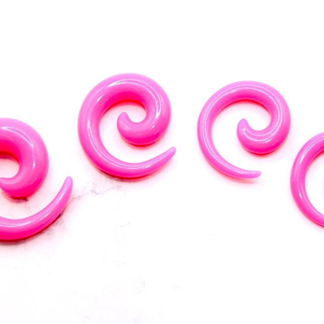 These Pink Acrylic Spiral Taper Earrings are a stylish and low-maintenance option for stretched ears. The sleek spiral design adds visual interest while remaining lightweight and easy to wear. Perfect for everyday use or to enhance your alt aesthetic, these tapers offer a bold yet classic look.