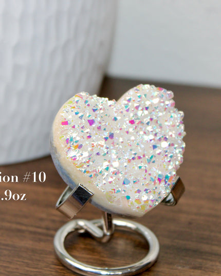 These Electroplated Aura Quartz Hearts combine the universal symbol of love with brilliant color and energy—set beautifully on a metal stand for easy display. Whether you're building your altar, brightening a room, or gifting crystal magic, pick the piece that sparks your spirit.