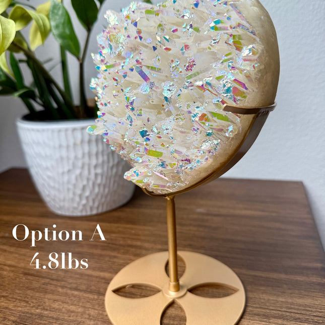 These Electroplated Aura Quartz Hearts combine the universal symbol of love with brilliant color and energy—set beautifully on a metal stand for easy display. Whether you're building your altar, brightening a room, or gifting crystal magic, pick the piece that sparks your spirit.