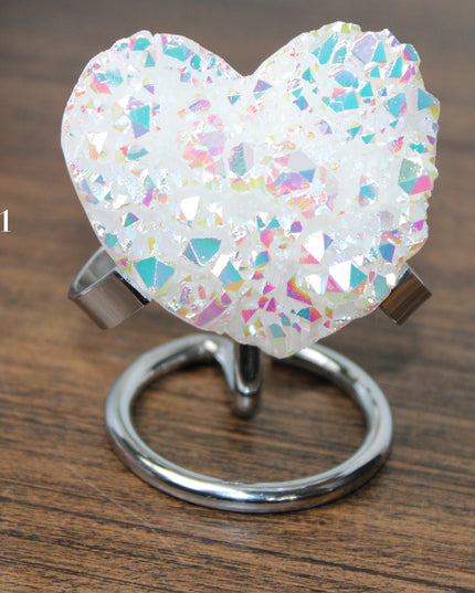These Electroplated Aura Quartz Hearts combine the universal symbol of love with brilliant color and energy—set beautifully on a metal stand for easy display. Whether you're building your altar, brightening a room, or gifting crystal magic, pick the piece that sparks your spirit.