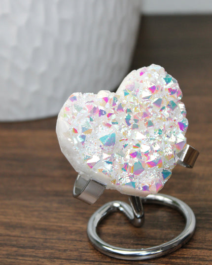These Electroplated Aura Quartz Hearts combine the universal symbol of love with brilliant color and energy—set beautifully on a metal stand for easy display. Whether you're building your altar, brightening a room, or gifting crystal magic, pick the piece that sparks your spirit.