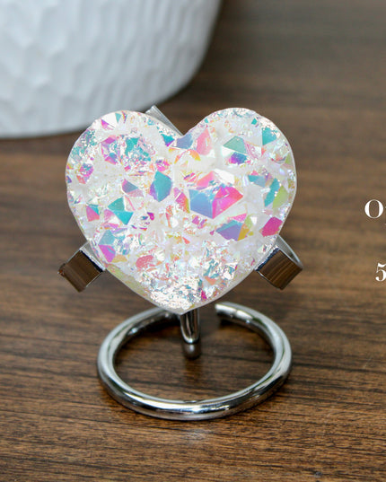 These Electroplated Aura Quartz Hearts combine the universal symbol of love with brilliant color and energy—set beautifully on a metal stand for easy display. Whether you're building your altar, brightening a room, or gifting crystal magic, pick the piece that sparks your spirit.