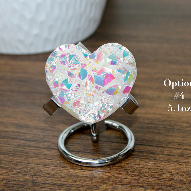 These Electroplated Aura Quartz Hearts combine the universal symbol of love with brilliant color and energy—set beautifully on a metal stand for easy display. Whether you're building your altar, brightening a room, or gifting crystal magic, pick the piece that sparks your spirit.