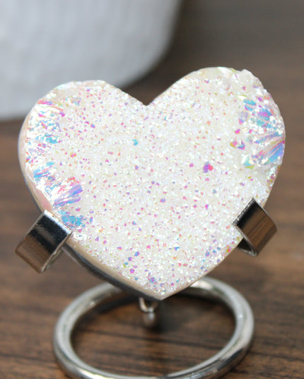 These Electroplated Aura Quartz Hearts combine the universal symbol of love with brilliant color and energy—set beautifully on a metal stand for easy display. Whether you're building your altar, brightening a room, or gifting crystal magic, pick the piece that sparks your spirit.