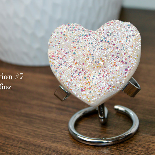 These Electroplated Aura Quartz Hearts combine the universal symbol of love with brilliant color and energy—set beautifully on a metal stand for easy display. Whether you're building your altar, brightening a room, or gifting crystal magic, pick the piece that sparks your spirit.