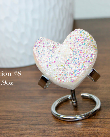 These Electroplated Aura Quartz Hearts combine the universal symbol of love with brilliant color and energy—set beautifully on a metal stand for easy display. Whether you're building your altar, brightening a room, or gifting crystal magic, pick the piece that sparks your spirit.