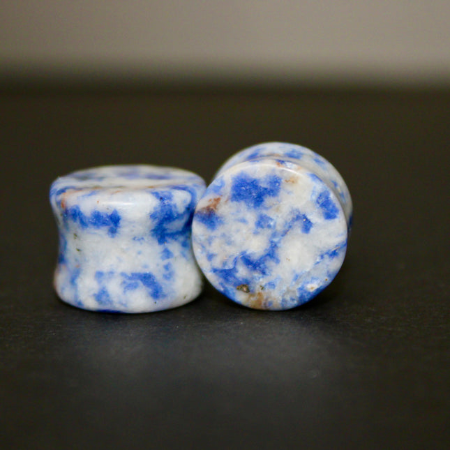 These Sodalite Double Flared Plugs bring natural beauty and calming energy to your stretched ears. Perfect for everyday wear or spiritual intention, they offer both style and substance.