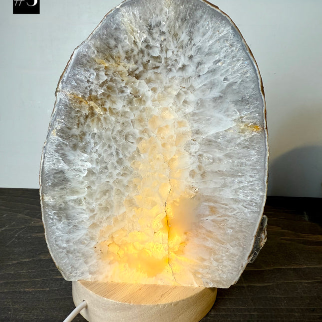 Decorative lamp with a natural stone design on a wooden base
