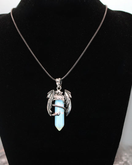 A fierce and enchanting Dragon Necklace with Opalite brings fantasy to life, featuring a detailed dragon wrapped protectively around a glowing opalite orb. The iridescent stone shimmers with soft hues of blue, lavender, and pearly white, catching light with a mystical glow. The dragon pendant is crafted with intricate scales and wings, giving it a bold, medieval-inspired aesthetic.