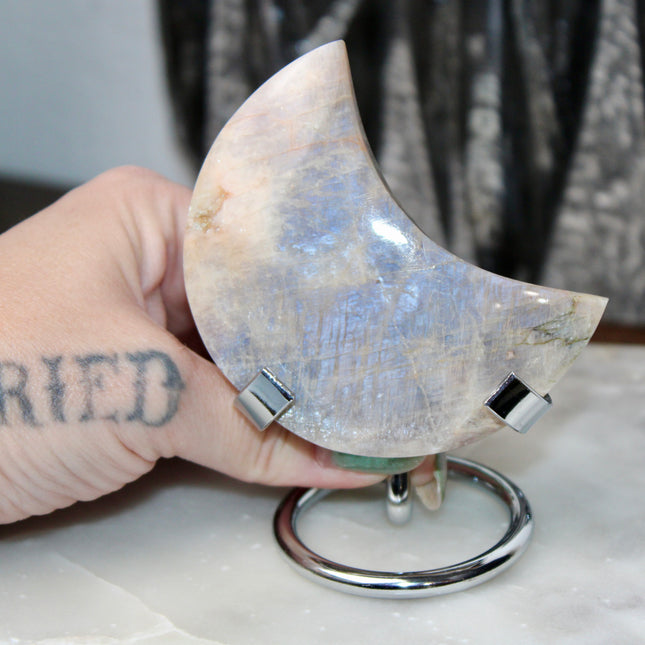 This Rainbow Moonstone Moon on a Stand is a stunning blend of celestial symbolism and crystal magic. Whether used in meditation, energy work, or simply as a glowing accent, it invites serenity, inspiration, and moonlit wisdom into your space.