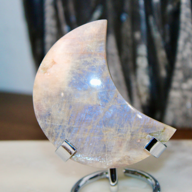This Rainbow Moonstone Moon on a Stand is a stunning blend of celestial symbolism and crystal magic. Whether used in meditation, energy work, or simply as a glowing accent, it invites serenity, inspiration, and moonlit wisdom into your space.