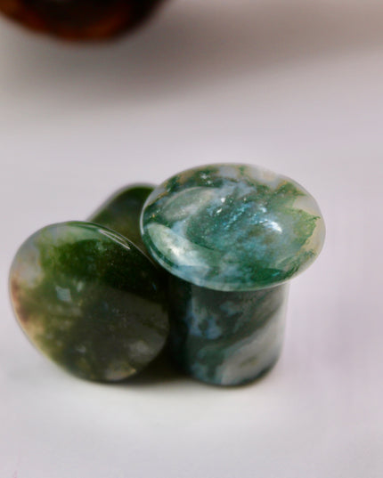 These Grade A Moss Agate Single Flare Plugs offer both comfort and crystal energy in one elegant pair. Ideal for nature lovers, energy workers, or anyone who appreciates the earthy charm of natural stone jewelry.