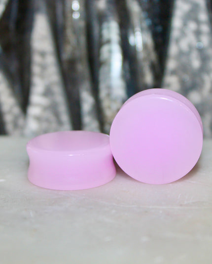 These Pink Agate Double Flare Plugs combine crystal healing with bold color and natural elegance—perfect for everyday wear or adding a soft, grounding energy to your stretched ear style.