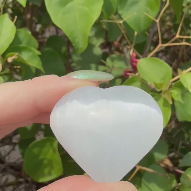 Bring calm, clarity, and loving energy into your life with this beautifully polished 30mm Selenite Heart. Carved from genuine selenite, this heart-shaped crystal is perfect for energy cleansing, emotional healing, and amplifying peaceful vibes in any space.
