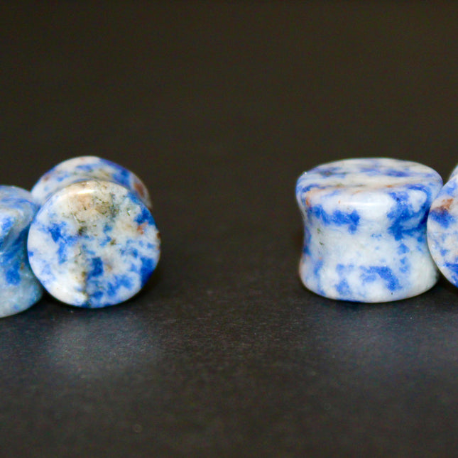 These Sodalite Double Flared Plugs bring natural beauty and calming energy to your stretched ears. Perfect for everyday wear or spiritual intention, they offer both style and substance.