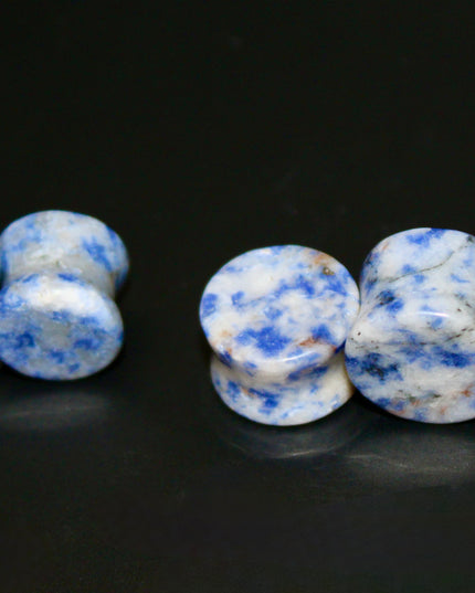 These Sodalite Double Flared Plugs bring natural beauty and calming energy to your stretched ears. Perfect for everyday wear or spiritual intention, they offer both style and substance.