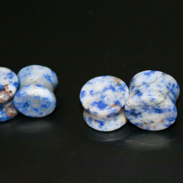 These Sodalite Double Flared Plugs bring natural beauty and calming energy to your stretched ears. Perfect for everyday wear or spiritual intention, they offer both style and substance.
