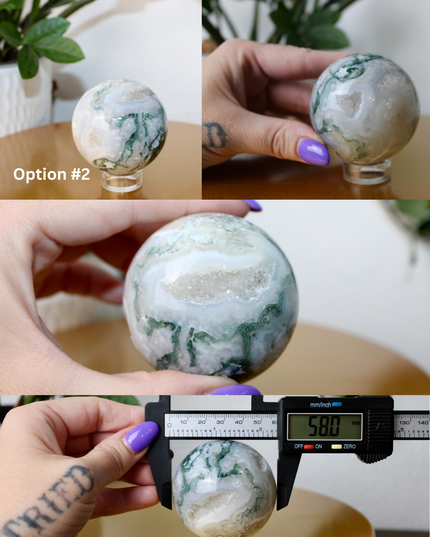 This XL Moss Agate Sphere features a stunning mix of natural green inclusions and cloudy white tones, reminiscent of forest landscapes or underwater gardens. Each sphere is one of a kind, with swirling patterns and depth that make it a true conversation piece.