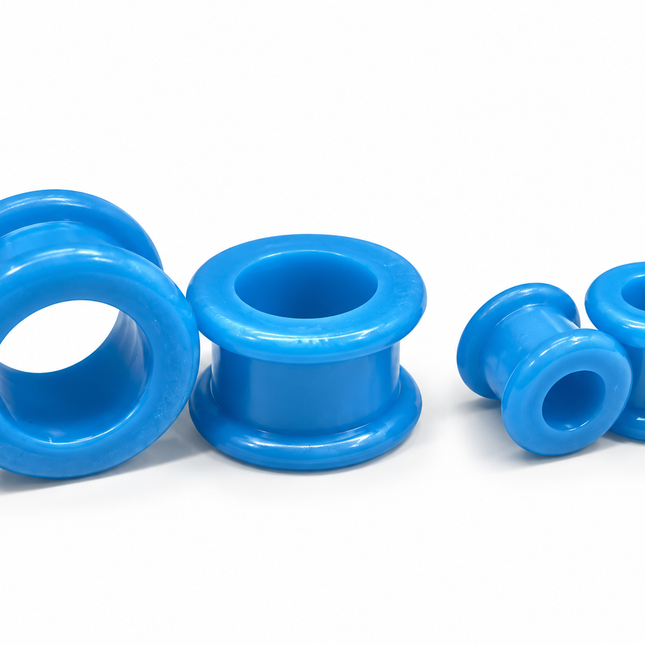 Four bright blue silicone ear plugs in various sizes, arranged on a clean white background.