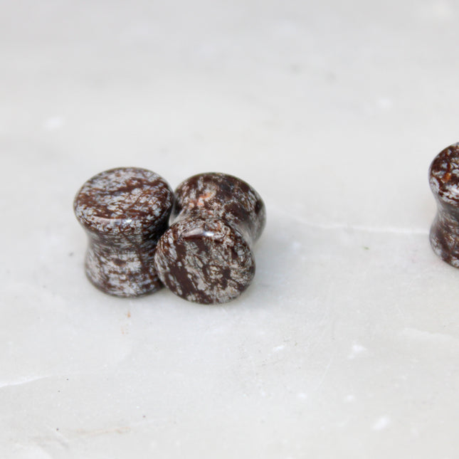 These Double Flare Brown Snowflake Obsidian Plugs bring together natural stone beauty and meaningful energy—perfect for everyday wear, spiritual practice, or anyone seeking balance with a striking, earthy edge.